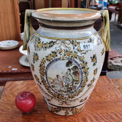 697 - A large ceramic double handled amphora style vase. Handpainted with a detailed floral backdrop and a... 