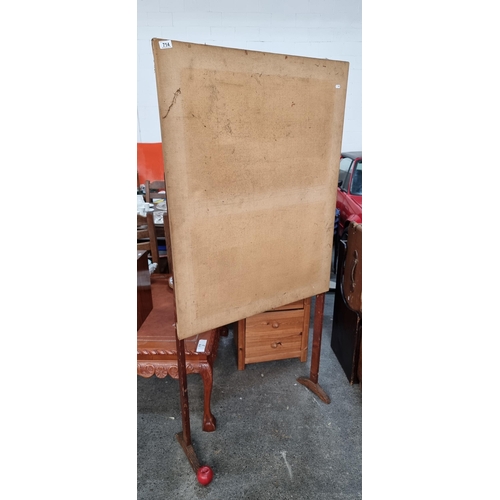 714 - An antique freestanding pin board. Featuring a wooden frame and stretched canvas backing designed fo... 