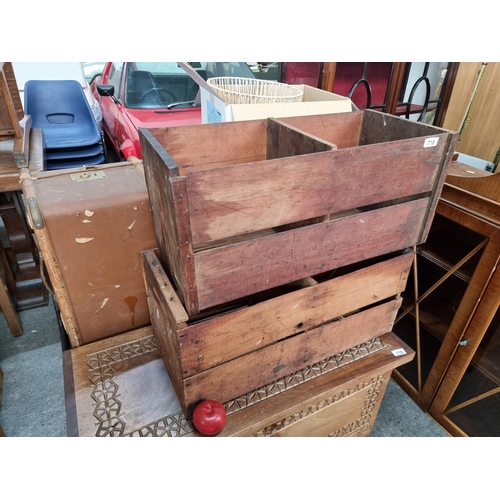 718 - A pair of antique delivery crates of Brazilian origin featuring remnants of original label.