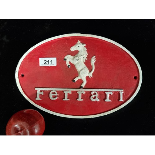 902 - An ovular metal wall sign advertising Ferrari in a bold shade of red with silver lettering.
Previous... 