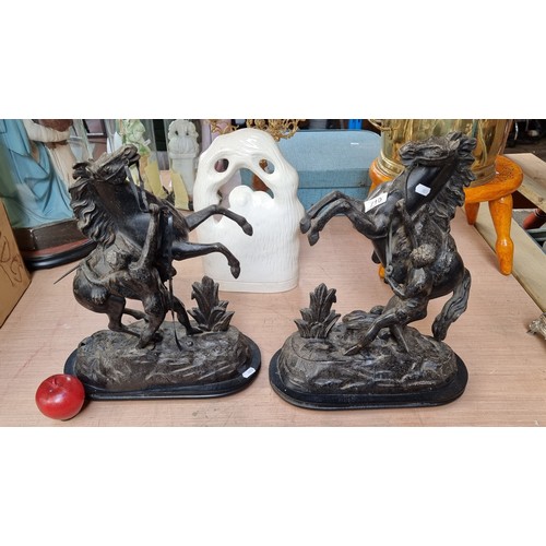 908 - A pair of very large 19th century heavy cast metal Marley horse figures. In a black finish. Slight d... 