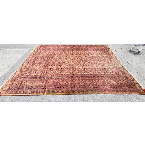 659 - Star lot : A spectacular vintage hand knotted rug boasting an intricate geometric pattern in vibrant... 