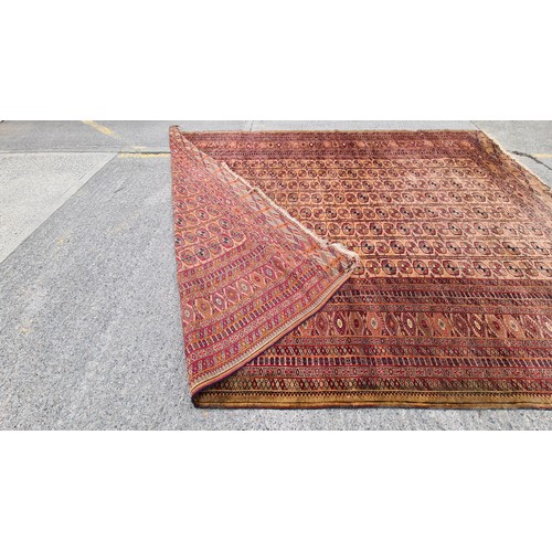 659 - Star lot : A spectacular vintage hand knotted rug boasting an intricate geometric pattern in vibrant... 