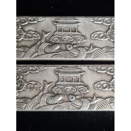 399 - Two Chinese silver bouillon bars made for scroll weight inlay. Each decorated with ornate dragon and... 