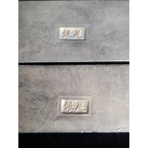 399 - Two Chinese silver bouillon bars made for scroll weight inlay. Each decorated with ornate dragon and... 