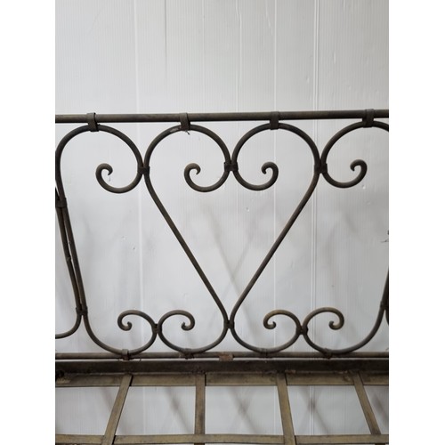 390 - A wonderful and very heavy antique wrought iron foldable day bed/bench with a drop-down base and hin... 