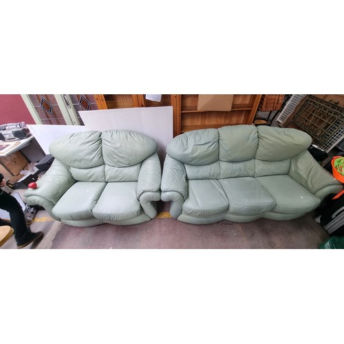 391 - A pair of impressive mint green leather sofas. Including a three-person couch and a two-person couch... 