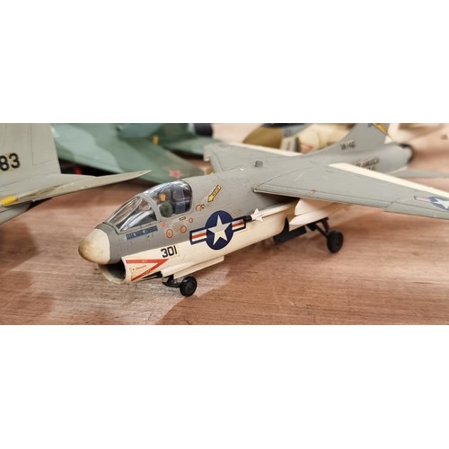 398 - Eleven military plastic model fighter airplanes including a Grumman F-14 Tomcat and a LTV A-7 Corsai... 