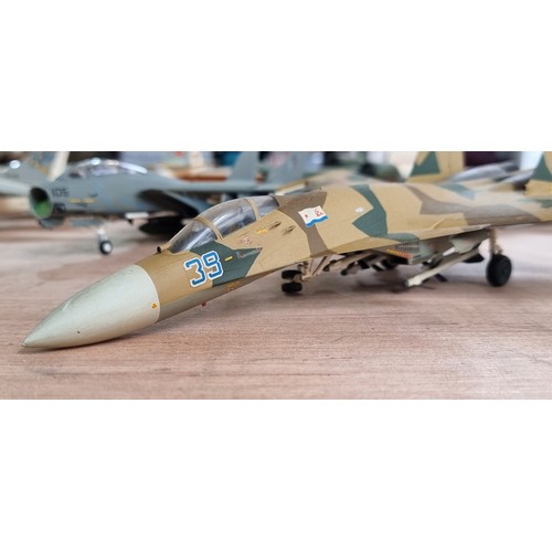 398 - Eleven military plastic model fighter airplanes including a Grumman F-14 Tomcat and a LTV A-7 Corsai... 