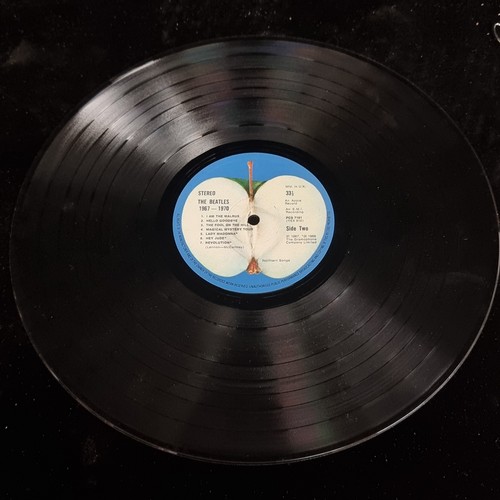 301 - Five items of musical interest consisting of two vinyl records of music by the Beatles including 'Ab... 