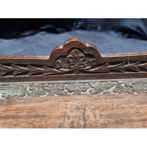 369 - Two antique wood items including a serving tray with elaborate ornament carved throughout. Along wit... 