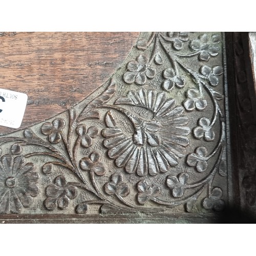 369 - Two antique wood items including a serving tray with elaborate ornament carved throughout. Along wit... 