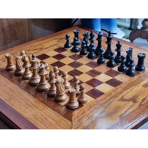 553 - Star Lot : A beautiful vintage chess table with a two-tone wooden top complete with an original set ... 