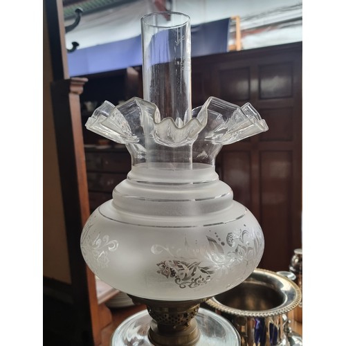 581 - Star lot : A very impressive antique oil lamp with a brass reeded column base, a clear reservoir, a ... 