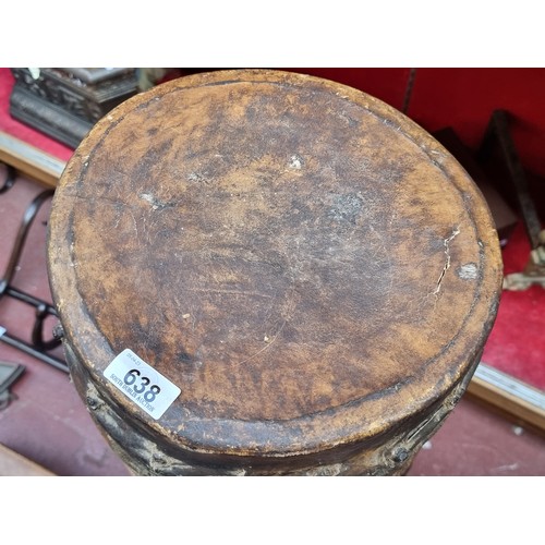 638 - Star lot : An antique large Africa friction drum with a hollow cylindrical body with animal skin str... 