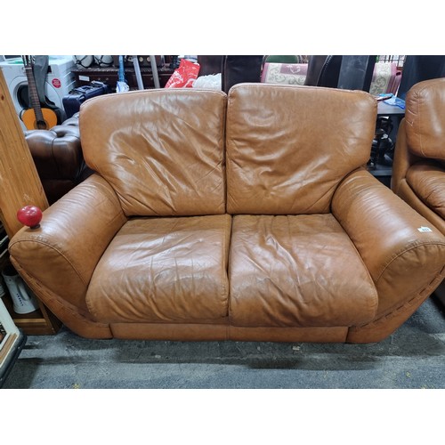 657 - Star lot : A pair of very comfortable two seater leather sofas, with a wonderful curved frame and up... 