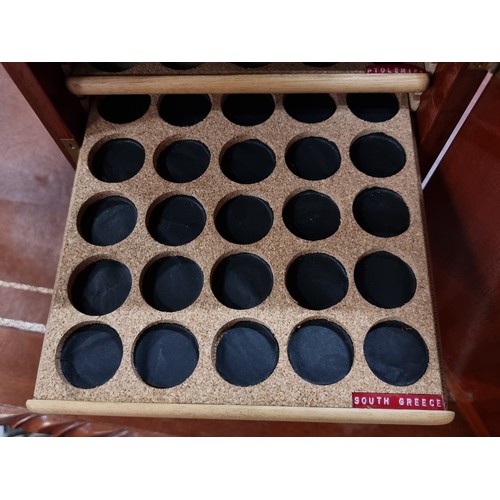 712 - Star Lot: A fabulous example of a serious coin collectors cabinet featuring fifteen retractable shel... 