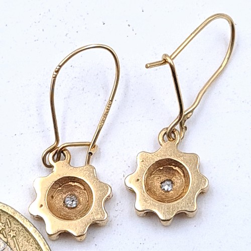 506 - A beautiful pair of antique 9 carat gold Diamond drop earrings, featuring a fabulous sun burst desig... 