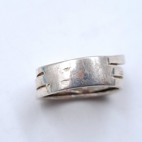 508 - A heavy Russian silver gent's three strand channel ring. Ring size: T. Weight: 8.54 grams.