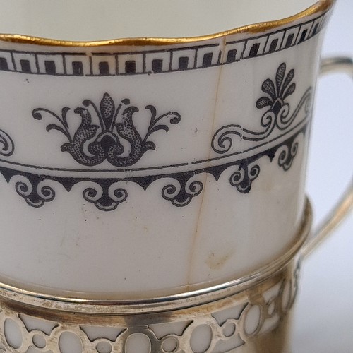 516 - A beautiful pair of Aynsley fine bone china coffee cups, set with a stunning scroll and fan border a... 