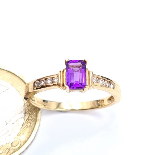 541 - Star lot : A very attractive 9 carat gold Amethyst and Diamond wide band set ring. Beautifull hue to... 