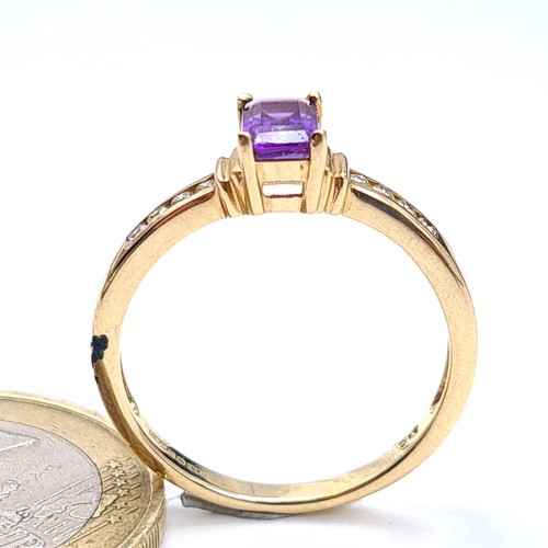 541 - Star lot : A very attractive 9 carat gold Amethyst and Diamond wide band set ring. Beautifull hue to... 