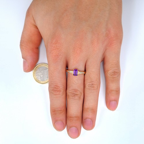 541 - Star lot : A very attractive 9 carat gold Amethyst and Diamond wide band set ring. Beautifull hue to... 