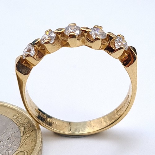 543 - A mesmerising 9 carat gold five stone Moissanite ring, set nicely on a wide band and showing import ... 