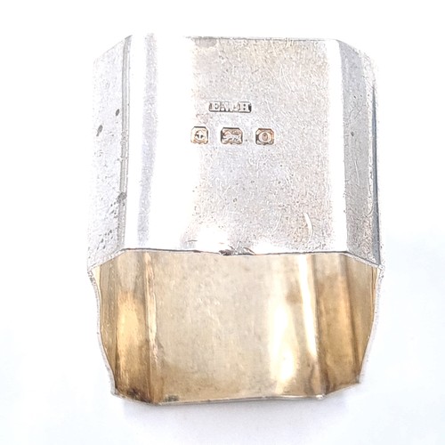 548 - A pair of vintage sterling silver octagonal napkin rings, hallmarked Birmingham, 1933 with the maker... 