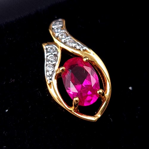 549 - A fine pair of Ruby and White Sapphire 9 carat gold plated stud earrings. Boxed, old new stock.