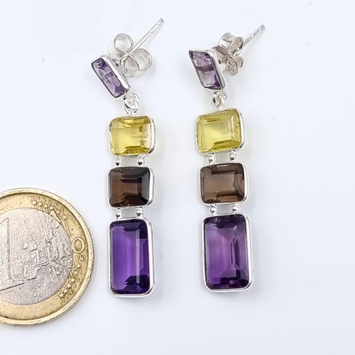 20 - A fabulous pair of Amethyst and Lemon Topaz drop earrings, set in sterling silver a featuring excell... 