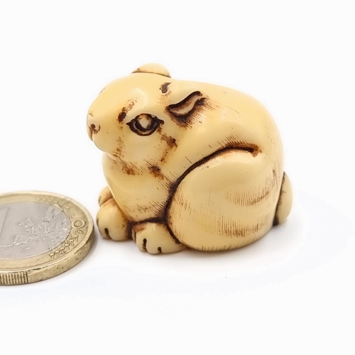 33 - A fine example of a vintage Netsuke, in the form of a perched rabbit. Excellent age to piece. Dimens... 