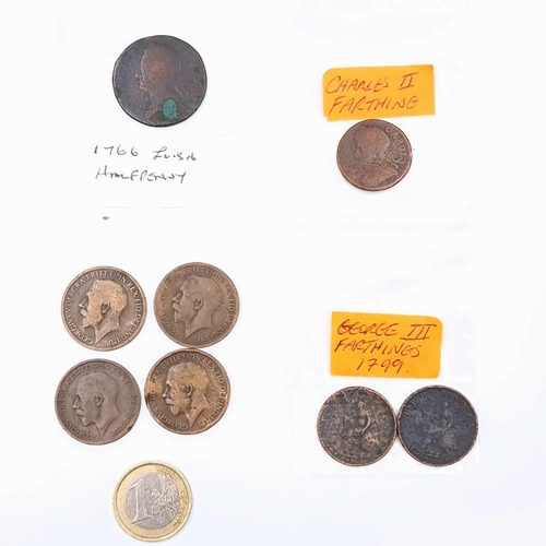 44 - A very interesting collection, consisting of a Charles II farthing, a 1766 Irish half penny and a 17... 