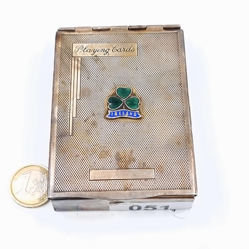 51 - A vintage silver plated playing card case, set with an enamelled shamrock and Ireland motif. The cas... 