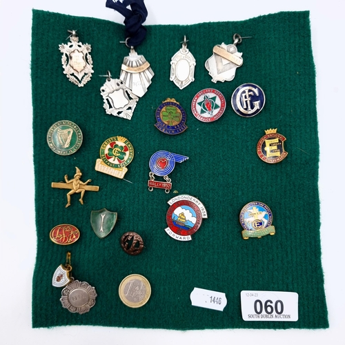 60 - A collection of assorted vintage badges and medallions, comprising of six sterling silver examples s... 