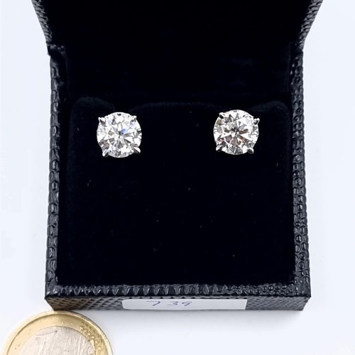 7 - A beautiful pair of sparkling Moissanite stone sterling silver earrings, with a total weight of 5 ca... 