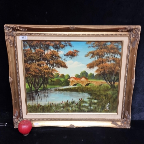 82 - A charming original oil on canvas board painting showing a riverside view of a terracotta tiled home... 