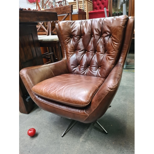 889 - Star Lot : A gorgeous example of a genuine leather wing back swivel chair by Wells Leather. Designed... 