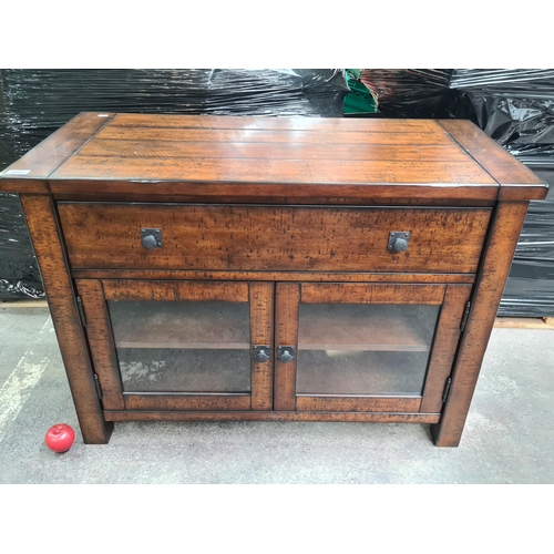 891 - Star Lot : A handsome stained wood television / tv stand. Ample cupboard storage to base with dropdo... 