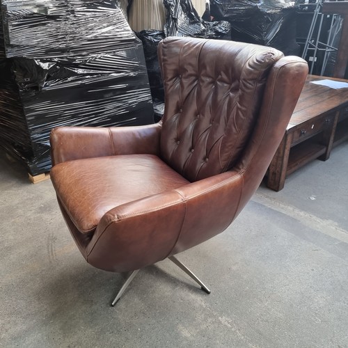 890 - Star Lot : A gorgeous example of a genuine leather wing back swivel chair by Wells Leather. Designed... 