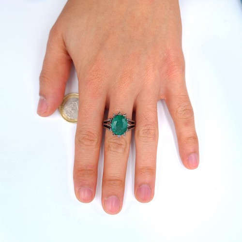 4 - Star Lot : A fabulous example of a Emerald and Diamond sterling silver ring, set beautifully with a ... 