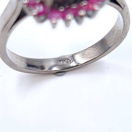 10 - An unusual natural Grey rough Diamond ring, of 6 carats and featuring a Ruby stone surround. Mounted... 