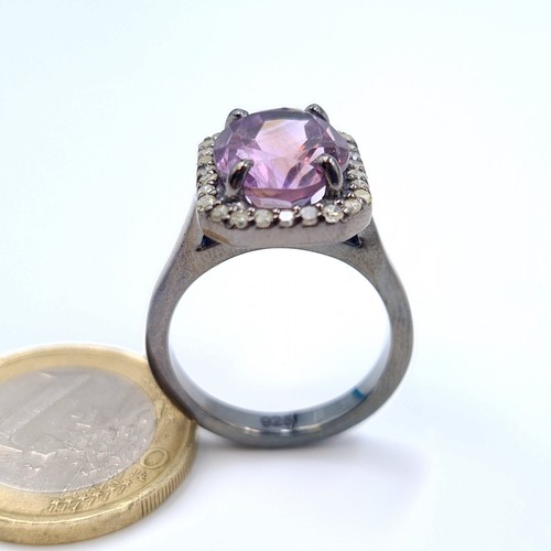 18 - Star Lot : A mesmerising Purple Ametrine and Diamond ring, set beautifully with a Diamond surround o... 