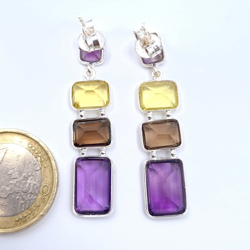 20 - A fabulous pair of Amethyst and Lemon Topaz drop earrings, set in sterling silver a featuring excell... 