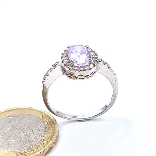 24 - A stunning example of a sterling silver Lilac Amethyst  ring, featuring a shimmering stone with a ha... 