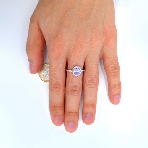 24 - A stunning example of a sterling silver Lilac Amethyst  ring, featuring a shimmering stone with a ha... 