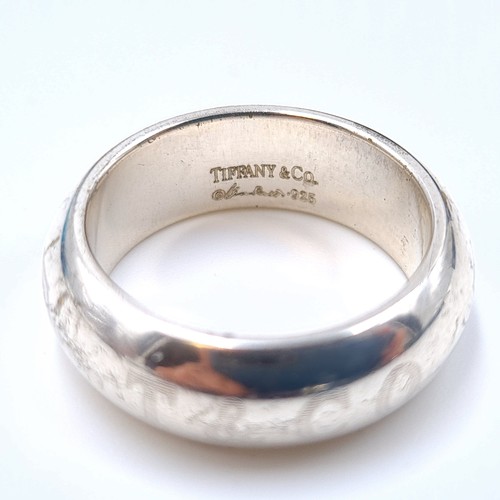 25 - A collection of high quality sterling silver items, consisting of a Tiffany & Co wide band heavy gau... 