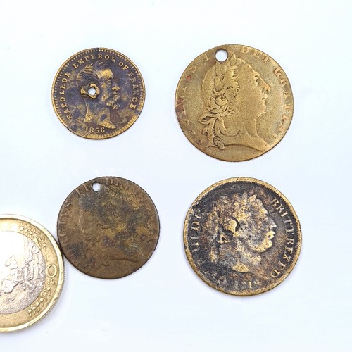 45 - A collection of tokens and coins, including two spade guinnie gambling tokens, a Queen Victoria gamb... 