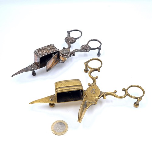 52 - An interesting collection of two 19th century candle snuffers, featuring a brass example with the in... 