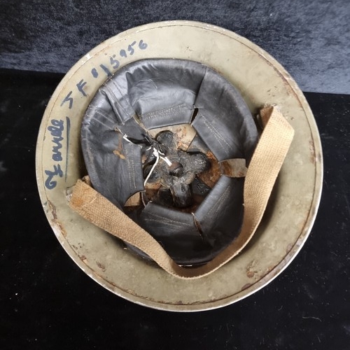 An Emergency Period WWII Irish Army Helmet with the badge of